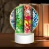 Round Acrylic Night Light, Three Colorful Designs Are Displayed On A Row Of Paper.
