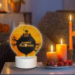 Round Acrylic Night Light, A Round Sign With A House And Bats On It That Says "Happy Halloween.". -Cute Night Light Shop 0657c8055fa1a2e3aef95198b5fc5c241a4d79f0