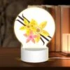 Round Acrylic Night Light, A Yellow Flower With A Pink Center Is Surrounded By Other Yellow Flowers. -Cute Night Light Shop 17ed7d464d66a8974cf0895bc4309a2633c07aef