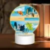 Round Acrylic Night Light, A Cityscape With A Beach And Palm Trees.