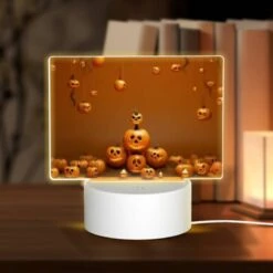 Rectangular Acrylic Night Light, A Bunch Of Pumpkins Are Hanging From Strings
