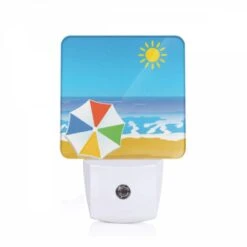 Night Light, A Colorful Umbrella Is On The Beach.