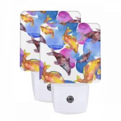 Night Light Set Of 2, A Painting Of Fish In A Blue And Pink Water.