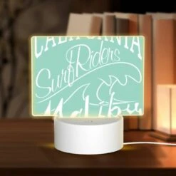 Rectangular Acrylic Night Light, A Surfboard With The Words California Riders Surf Surf Surf On It.