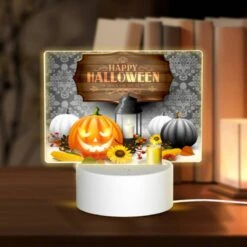 Rectangular Acrylic Night Light, A Halloween Poster With A Pumpkin And A Lit Candle.