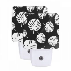 Night Light Set Of 2, A Pattern Of Leaves On A Black Background.