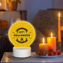 Round Acrylic Night Light, A Yellow Sign That Says "Happy Halloween" With A Skull And Crossbones On It. -Cute Night Light Shop 53346c93dabedd457a2b6ae7d9cca5c2aeee74b7