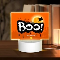 Rectangular Acrylic Night Light, A Halloween Poster With A Spooky Scene And The Word "BOO!" Written On It.