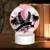 Round Acrylic Night Light, A Pink And Black Image Of A Bird With A Letter "U" On It.