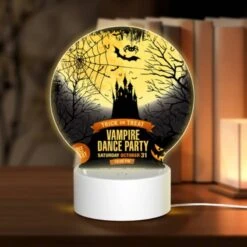 Round Acrylic Night Light, A Poster Advertising A Halloween Dance Party.