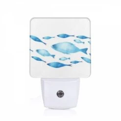 Night Light, A Blue Fish Swimming In A School Of Fish.