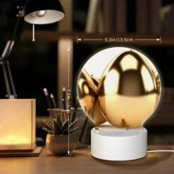 Round Acrylic Night Light, A Group Of Gold Eggs Are Sitting On A White Background. -Cute Night Light Shop 7f4e199a7728348b57f4764a7975d5364665c671
