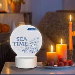 Round Acrylic Night Light, A Blue And White Graphic Design Of A Starfish And Shells. -Cute Night Light Shop 8bde8fa523d1619d52a8f3289d888f21c5862043