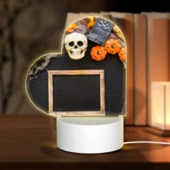 Front Page 35 Love Acrylic Night Light, A Black Frame With A Skull And Pumpkins In The Background.