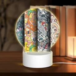 Round Acrylic Night Light, Four Different Colored Paintings Of Swirls And Designs.