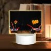 Rectangular Acrylic Night Light, A Table With Two Cups Of Candy And A Lit Candle.