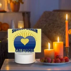 Rectangular Acrylic Night Light, A Yellow And Blue Logo For Sunset Beach California. -Cute Night Light Shop 9aced4d93188502293c17836aa5234d4f3b32dc7