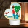 Love Acrylic Night Light, A Man With A Red Shirt And Sunglasses Is Standing On A Beach With A Suitcase. -Cute Night Light Shop 9f0a18deefae4239654e2c5fbbc02fb81307a663