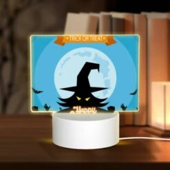 Rectangular Acrylic Night Light, A Witch's Hat Is Shown On A Poster With The Words "Happy Halloween" Written Below It.