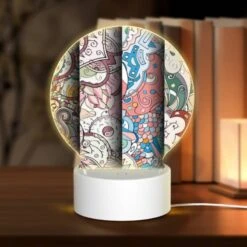 Round Acrylic Night Light, Three Colorful Artworks Are Displayed Side By Side.