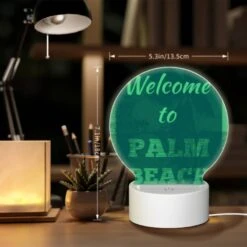 Round Acrylic Night Light, A Green And White Sign Welcoming Visitors To Palm Beach. -Cute Night Light Shop b0612b6aaaa51662d2c5c732741e7ee2cc0d8f6a