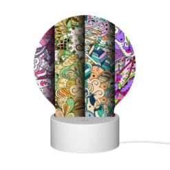 Round Acrylic Night Light, Three Colorful And Intricate Designs Are Displayed On A Row Of Paper. -Cute Night Light Shop b9f7ab01e87a6bb4193aca2e6e96c1796c537e76