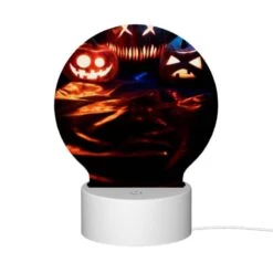 Round Acrylic Night Light, Three Pumpkins With Faces Carved Into Them Are Sitting On A Table. -Cute Night Light Shop ceac8693e259630d2f681e08d8be59b8bdccb00a