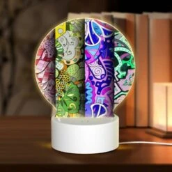 Round Acrylic Night Light, Four Different Colored Paintings Of Flowers.